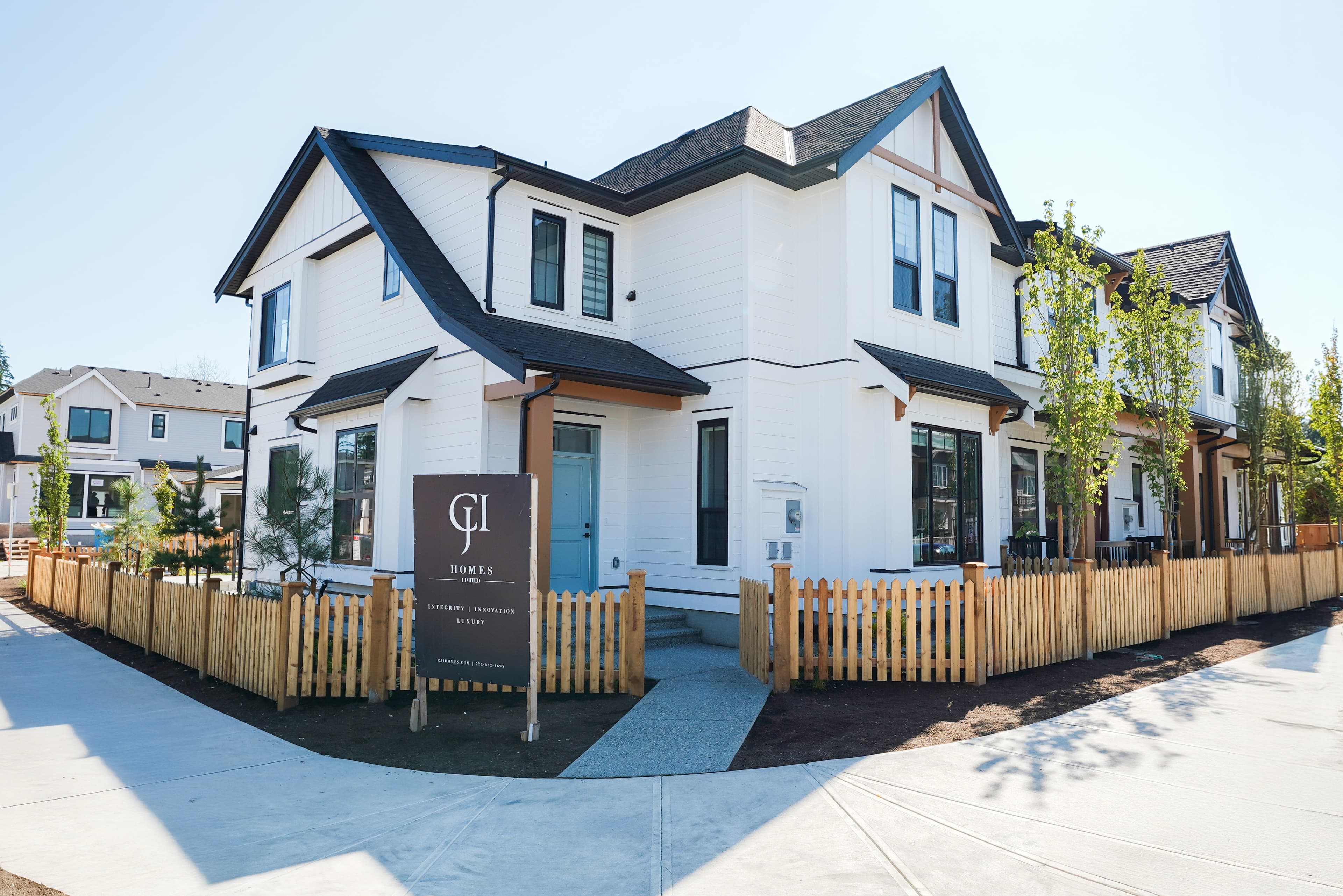 Exterior corner view of Willoughby Row, an 11-home rowhome community by CJI Group in Willoughby, Langley, BC