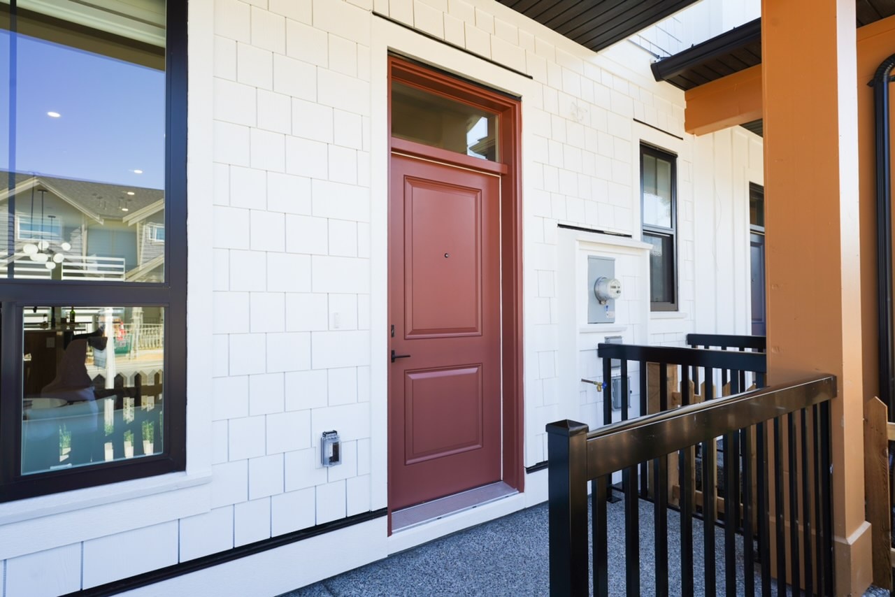 Front door and porch detail on a Willoughby Row home