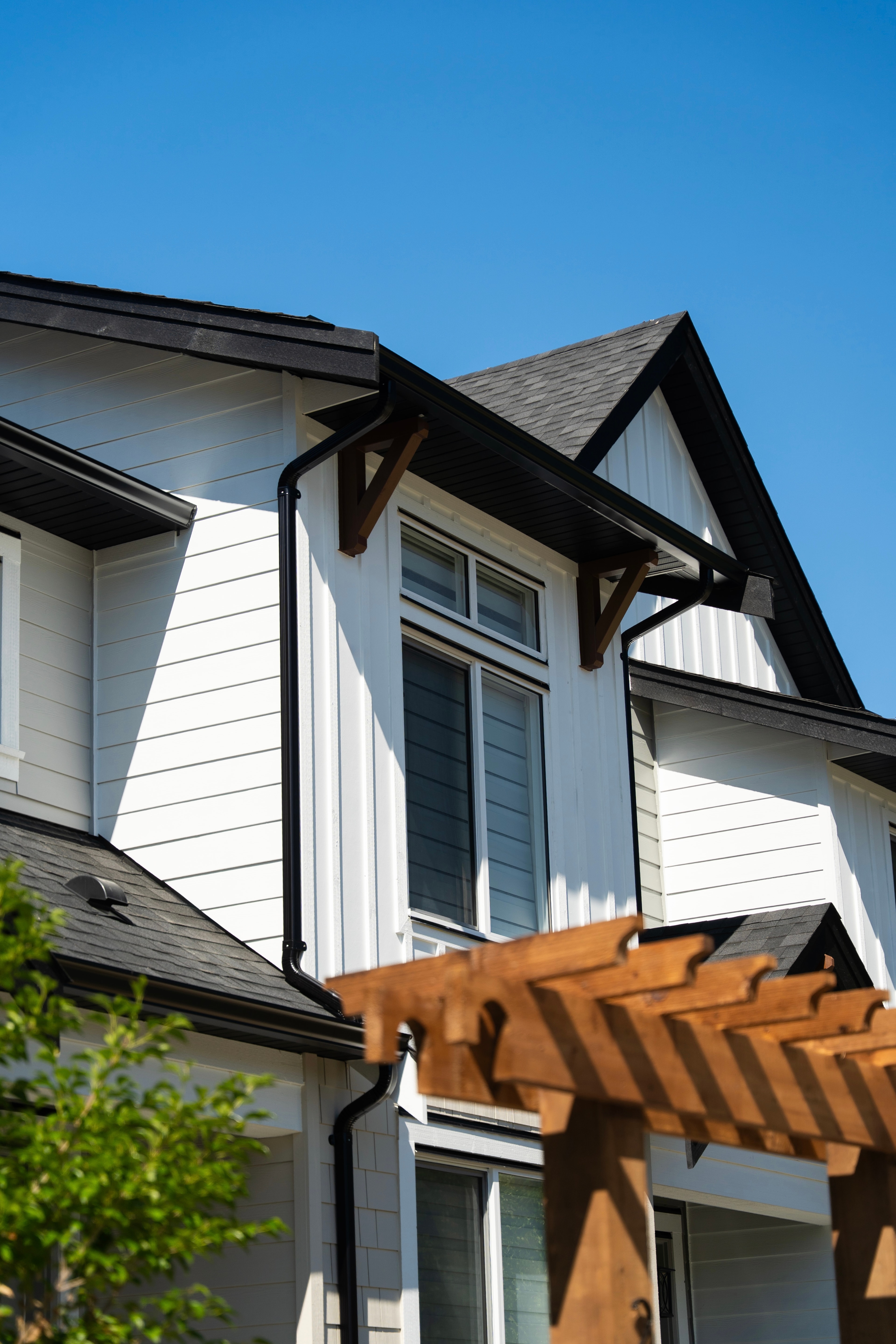 Gable roofline and eave detail of a completed CJI Group rowhome, Willoughby Row