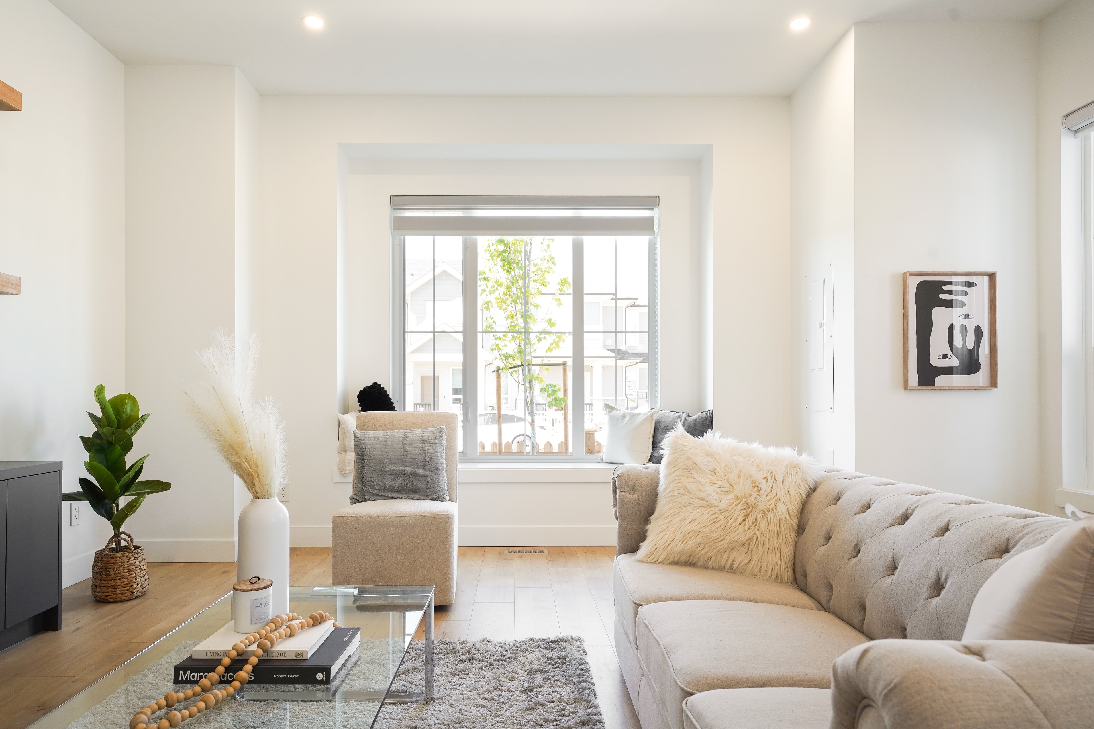 Warm, light-filled living room in a completed Willoughby Row home by CJI Group