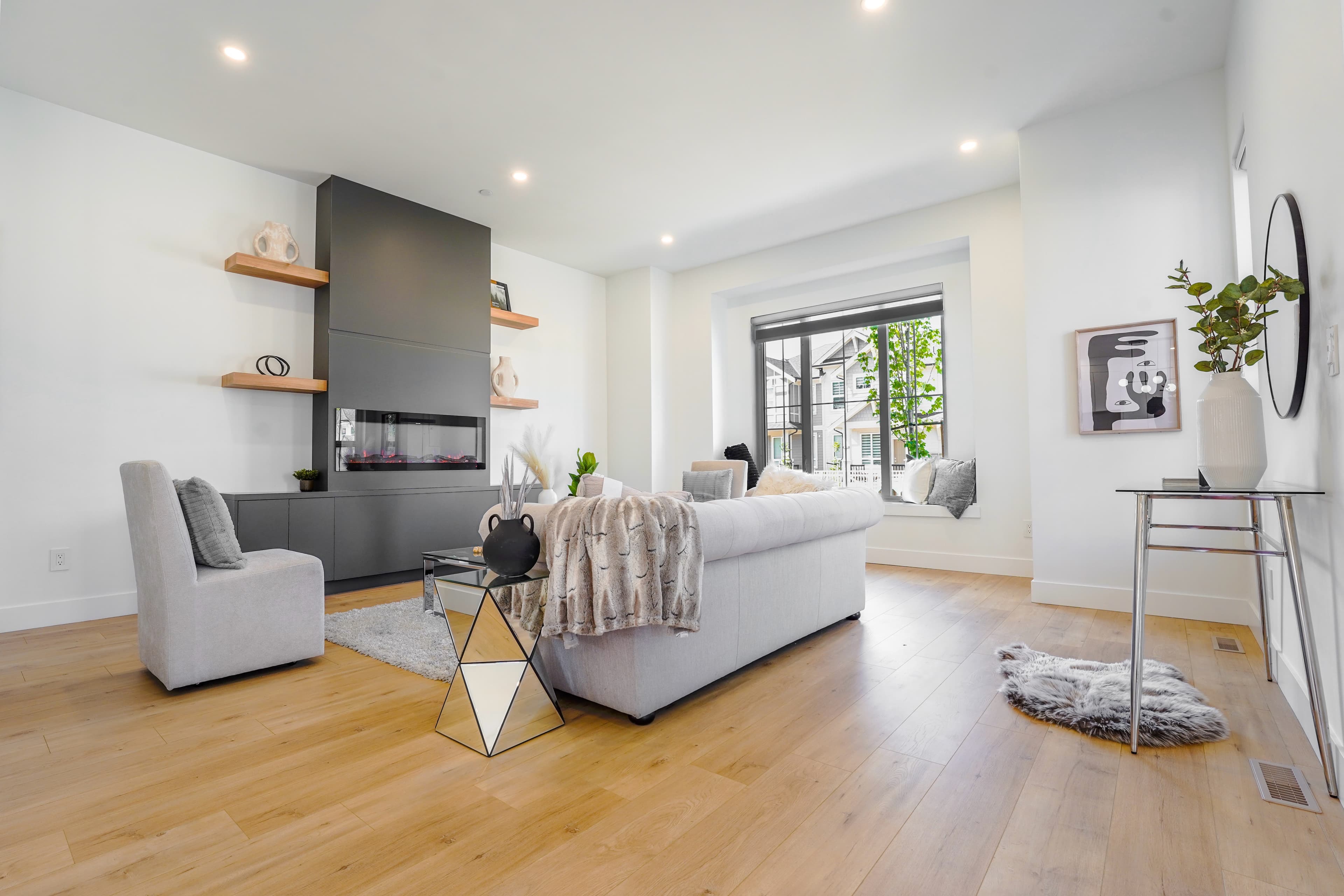 Living room at Willoughby Row with built-in fireplace wall and floating shelving